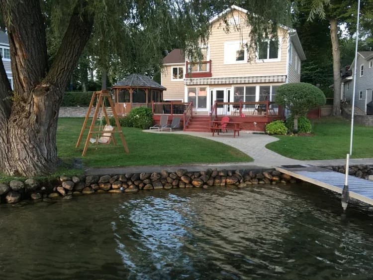 Natural stone retaining wall built by MTL Landscaping in Cass County, Michigan