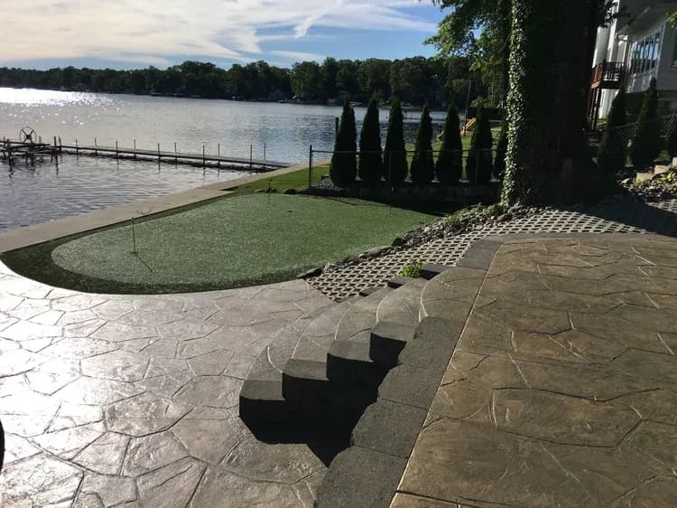 Lakeside patio with fire pit at a Sister Lakes, Michigan property
