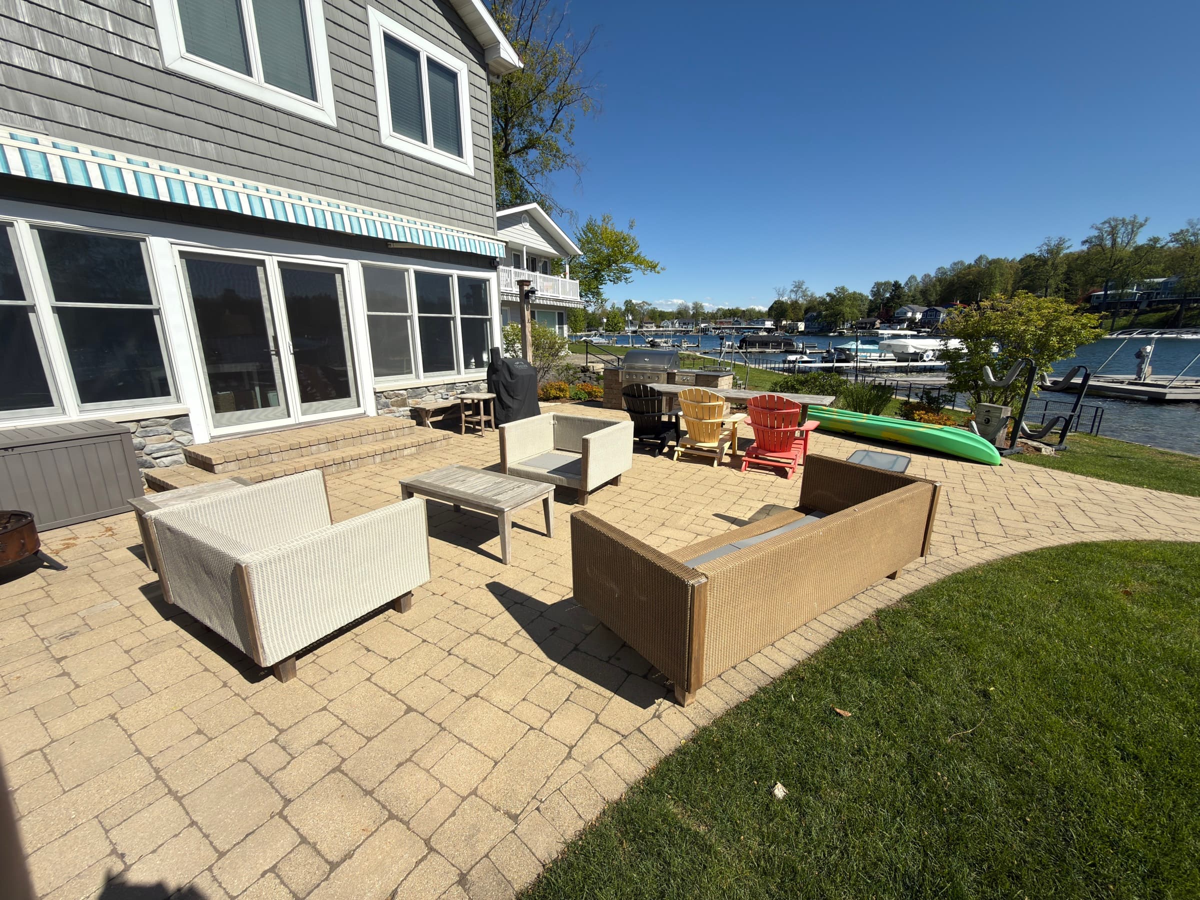 Lakeside paver patio with outdoor seating and marina view, Southwest Michigan