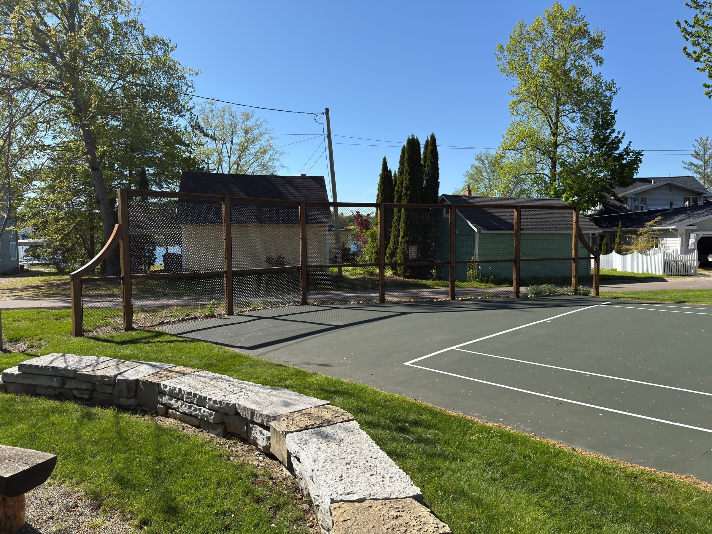 Sport court with chain link fencing at a Southwest Michigan property