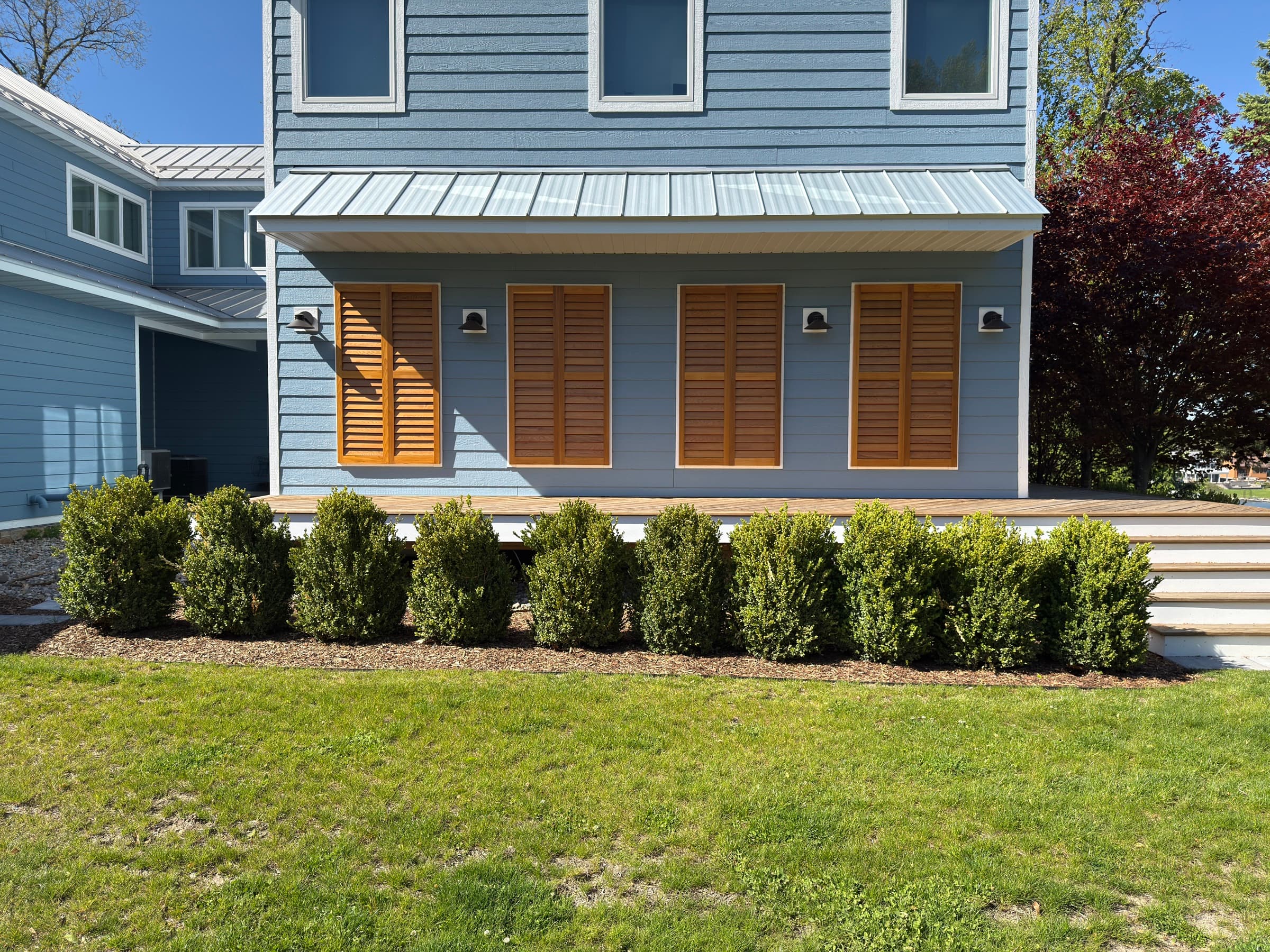 Boxwood plantings along a Southwest Michigan lake house